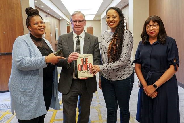 Gumbo Coalition graduates Shana Corbett and Tamiann Johnson-Young, both of York College, pose with Robert DeSalvio, President of Genting Americas East, and Michelle Stoddart, Vice President of Community Development, Resorts World New York City.